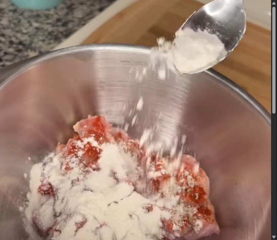 Step 1.1: Toss the chicken in flour until coated