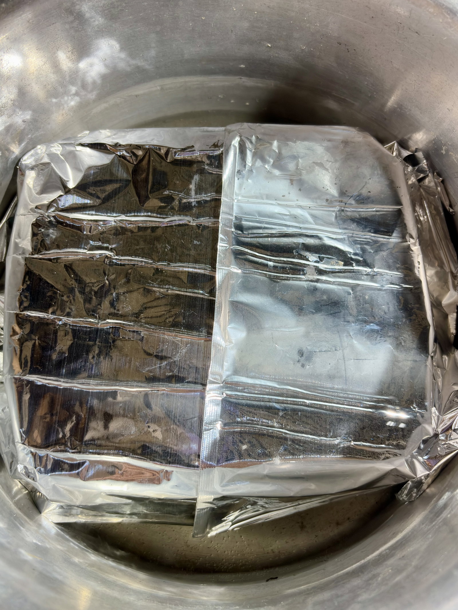 Step 3.2: Place a steamer basket or stand inside a large pot with an inch of boiling water