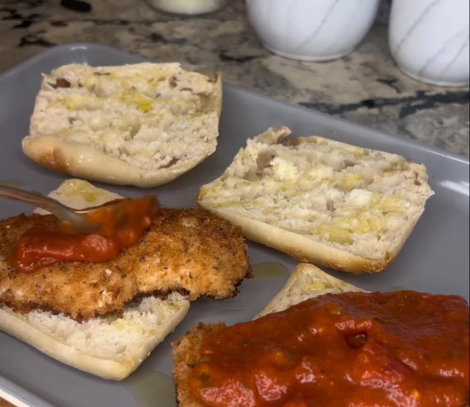 Step 1.1: Place chicken on the other half of each ciabatta roll and top with marinara and mozzarella