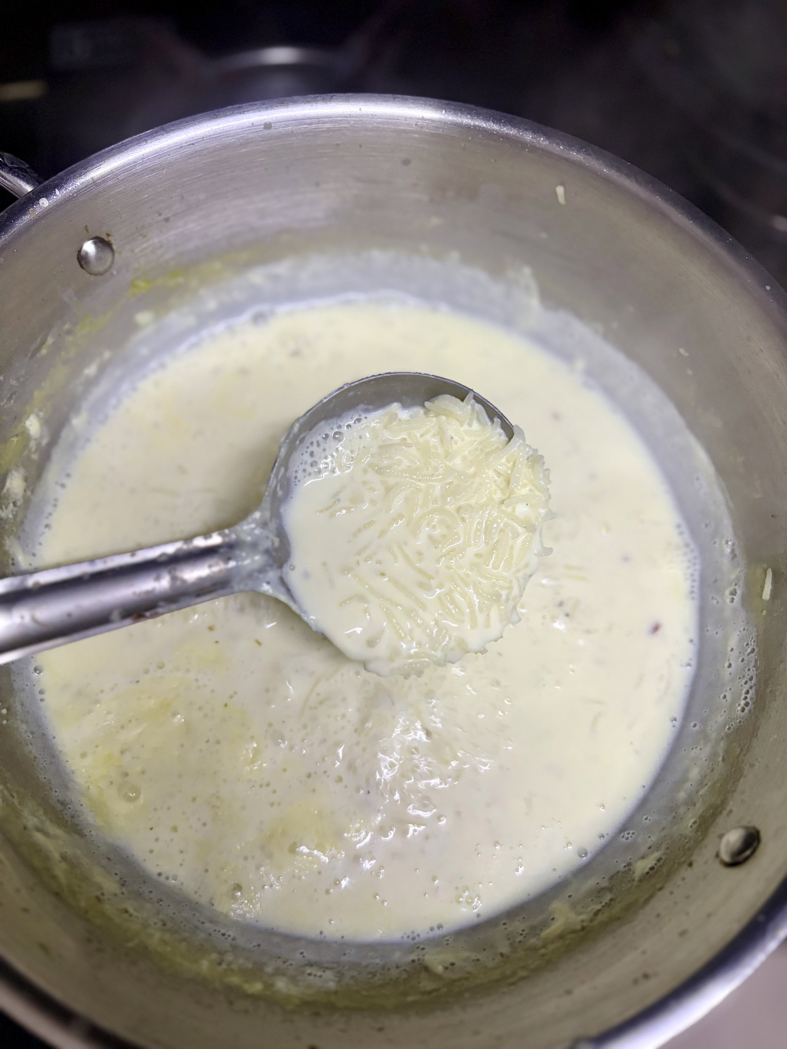 Step 4.1: Pour in the milk and add the cardamom powder