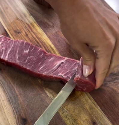 Step 1.1: Cut each tenderloin medallion into a swirl, gently unrolling it to create a thin, flat sheet
