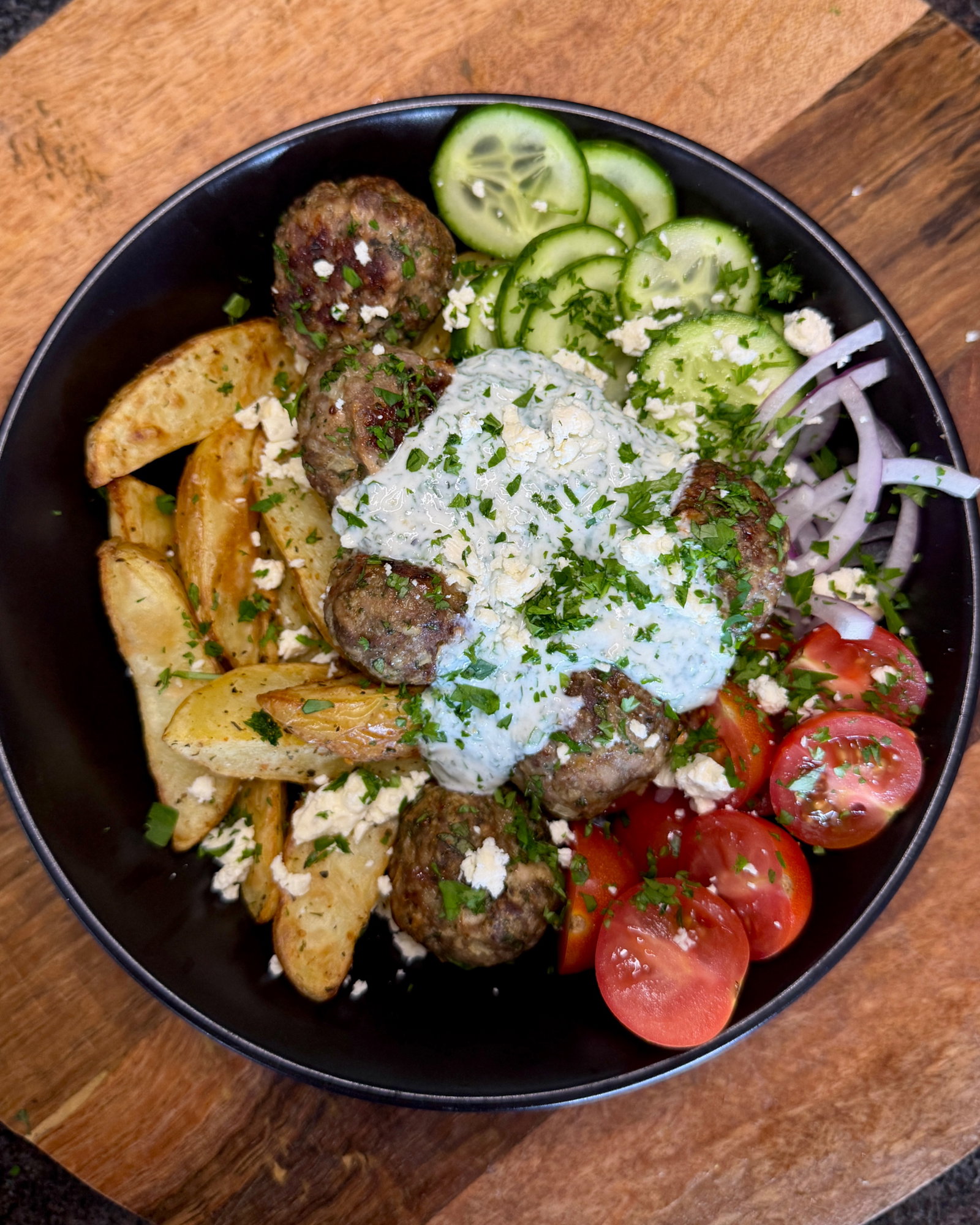 Mediterranean Beef Meatballs with Potato Wedges and Garlic Yoghurt Sauce recipe