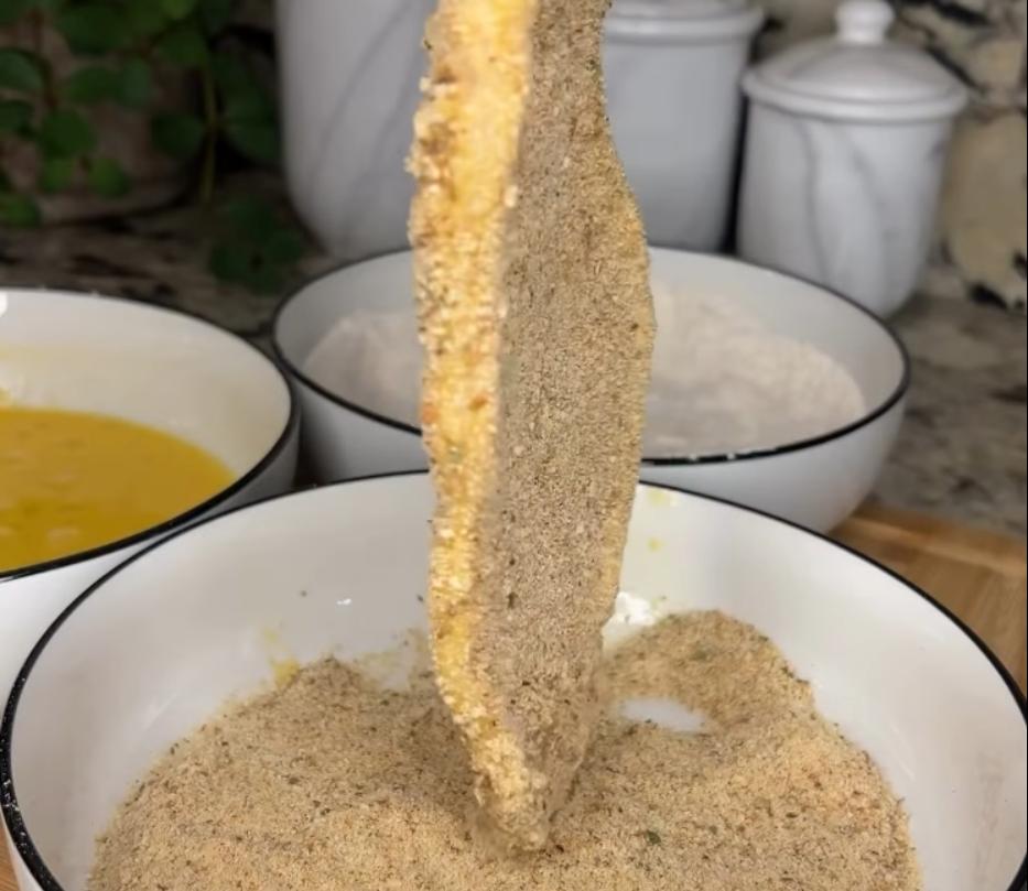 Step 1.1: Dunk chicken in the flour mixture, then egg wash, and finally coat with bread crumbs until fully covered on both sides
