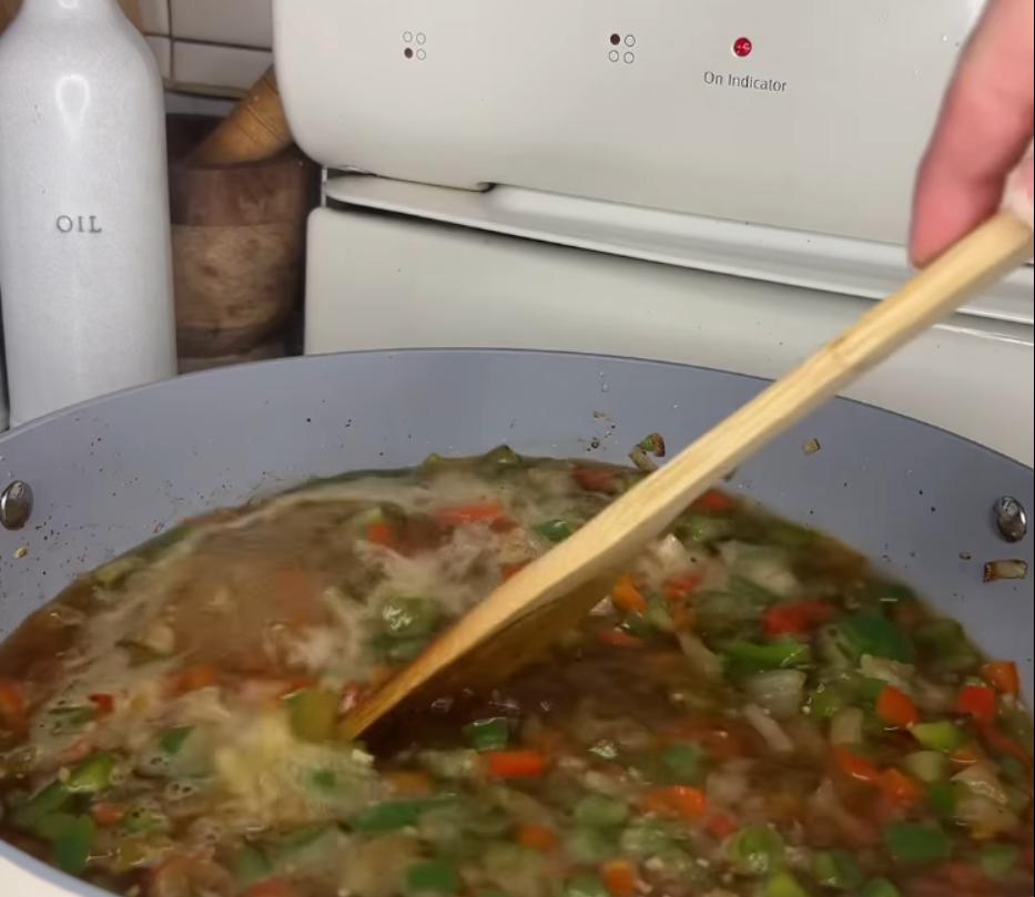 Step 1.1: Add chicken broth to the pan, bring to a simmer, and stir, scraping the browned bits off the bottom of the pan