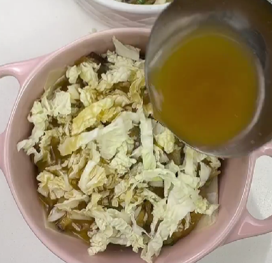 Step 3.1: In a ramekin, add a wrapper, then chicken filling, followed by Napa cabbage