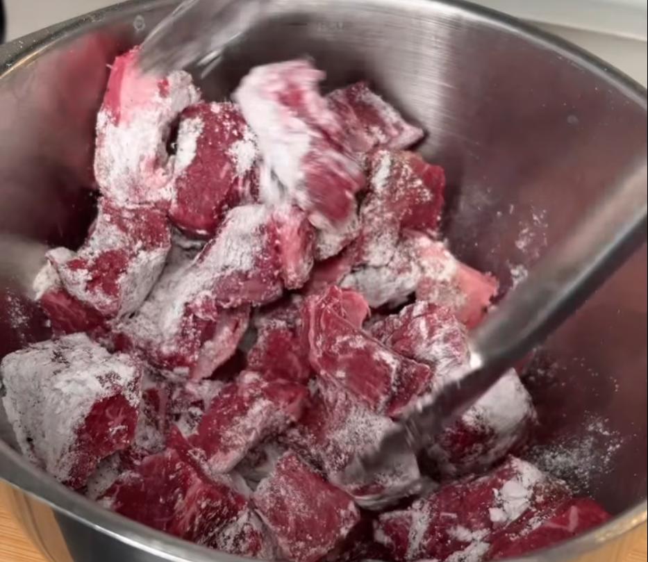 Step 1.1: Mix in flour, garlic salt, onion powder, and black pepper, and stir until beef is evenly coated