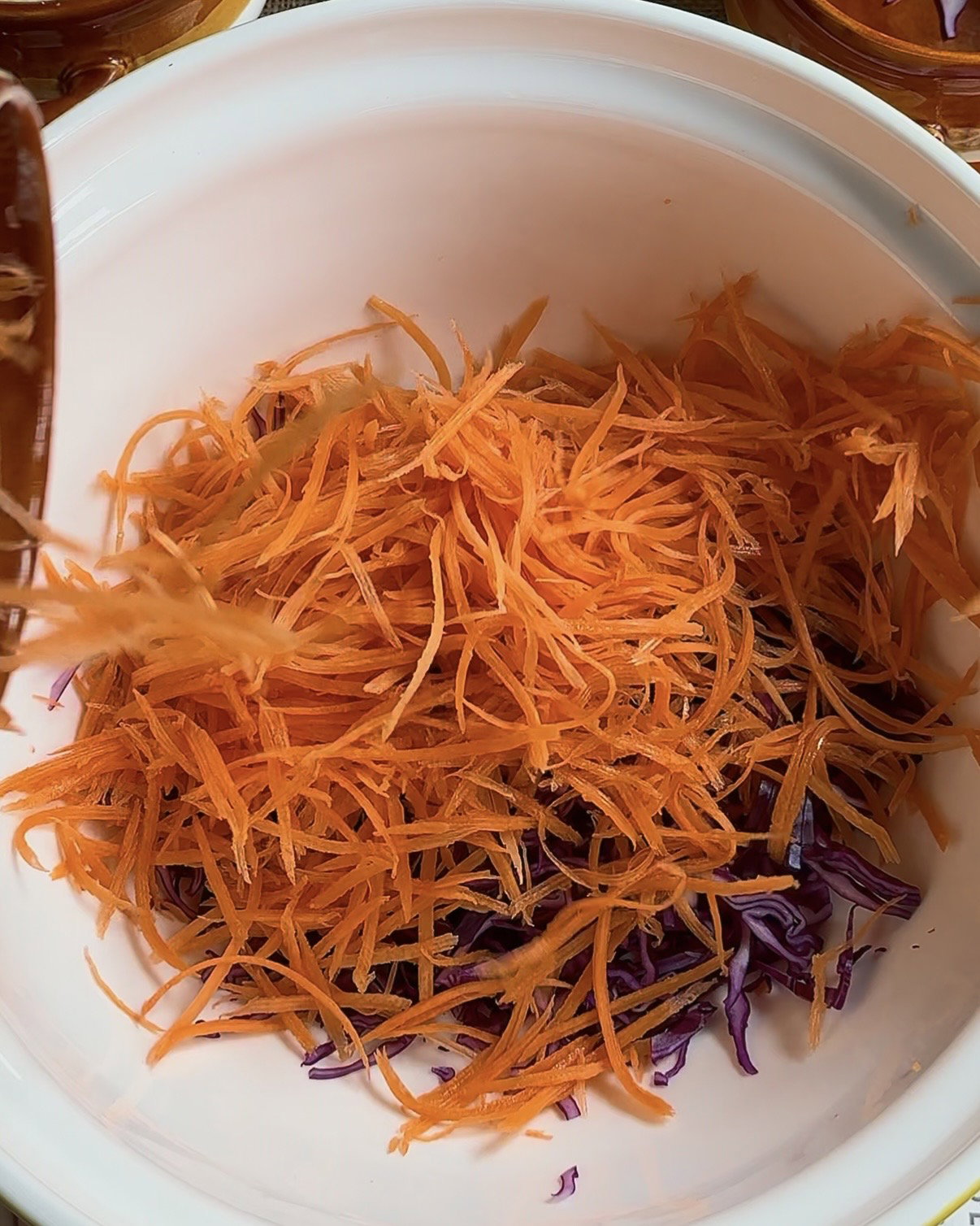 Step 2.2: Mix purple cabbage, carrots, sour cream, garlic granules, chives, and salt in a bowl until combined