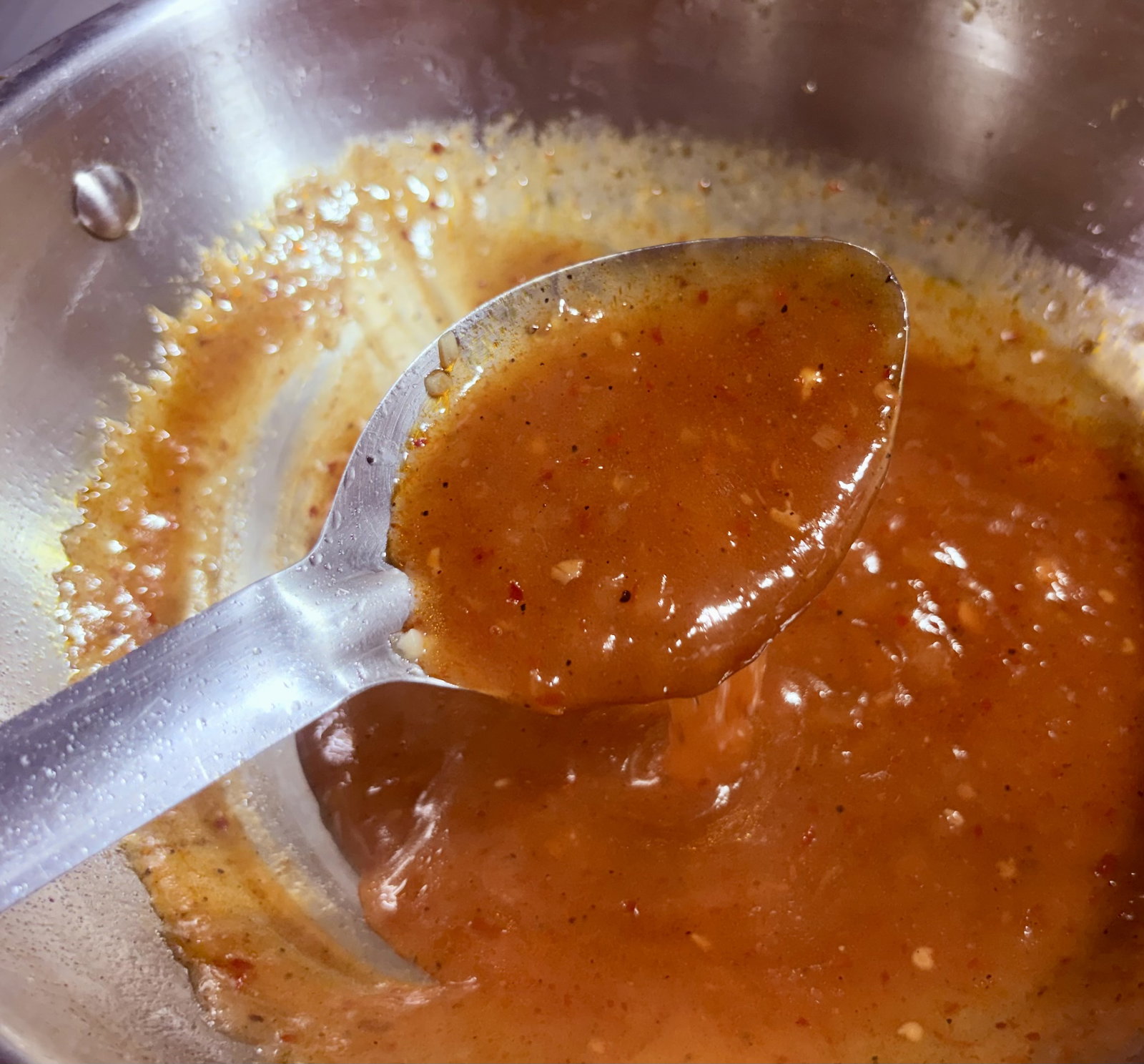 Step 3.2: Mix cornflour and water to make a slurry, then pour it into the simmering sauce