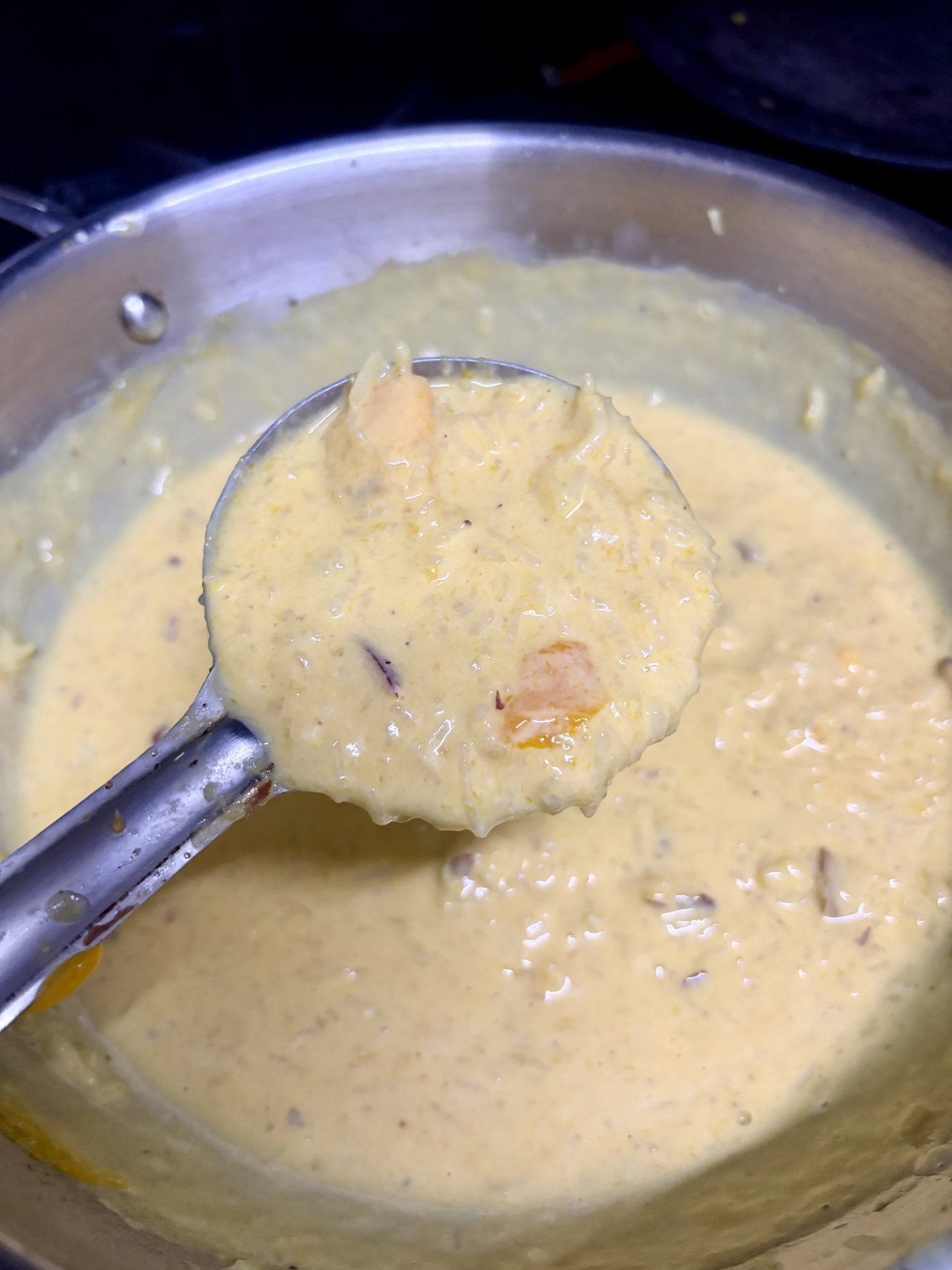 Step 7.2: Once cooled, gently fold in the mango puree and fresh mango chunks