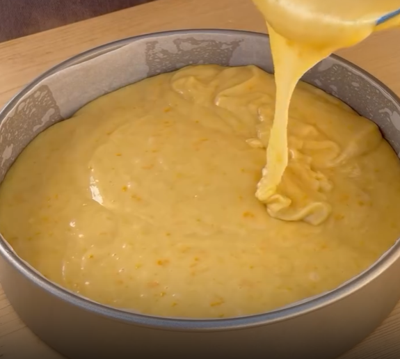 Step 3.1: Pour the batter over the arranged oranges