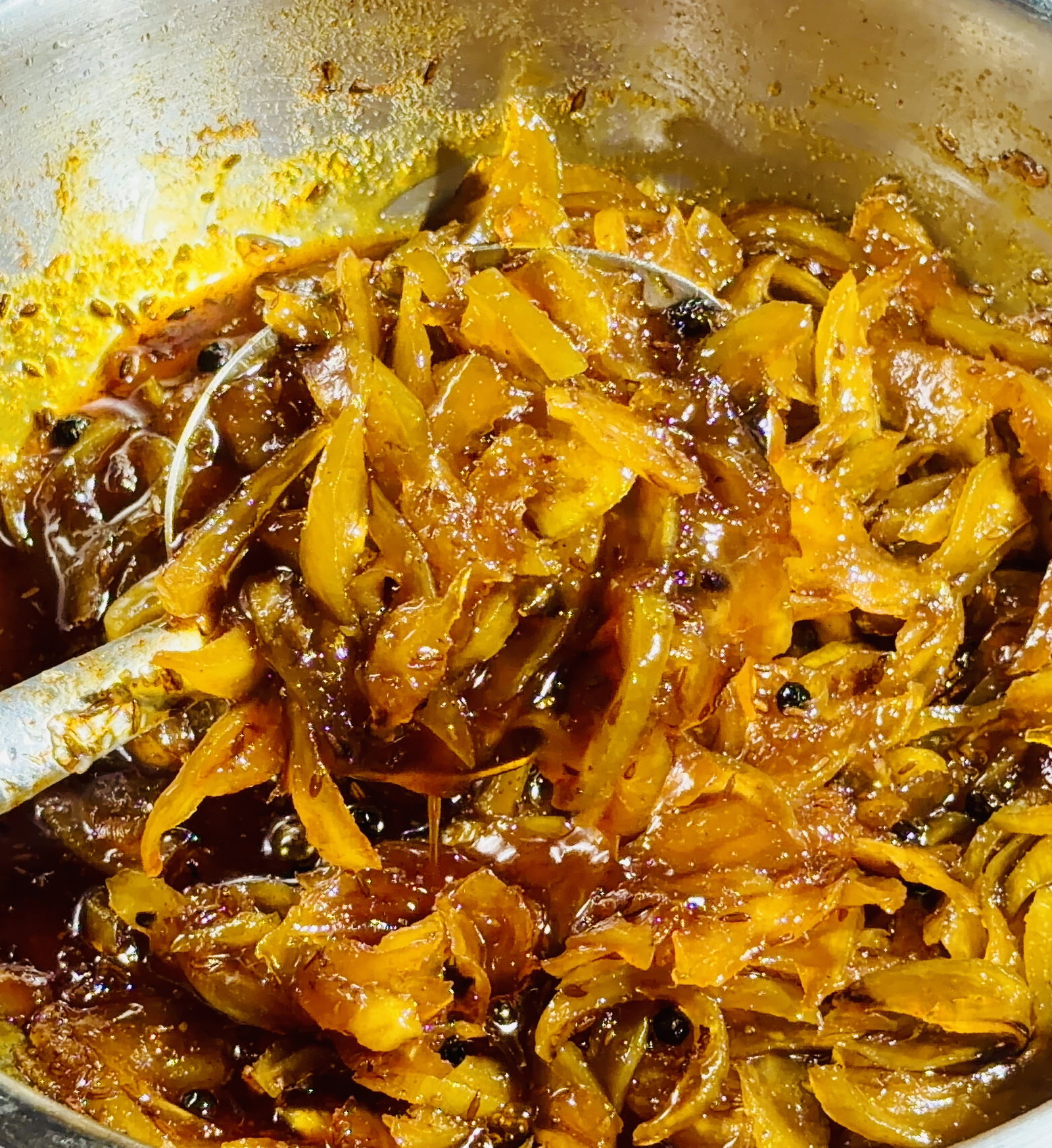 Step 2.1: Simmer stirring occasionally, until the mangoes soften further and the sugar syrup thickens