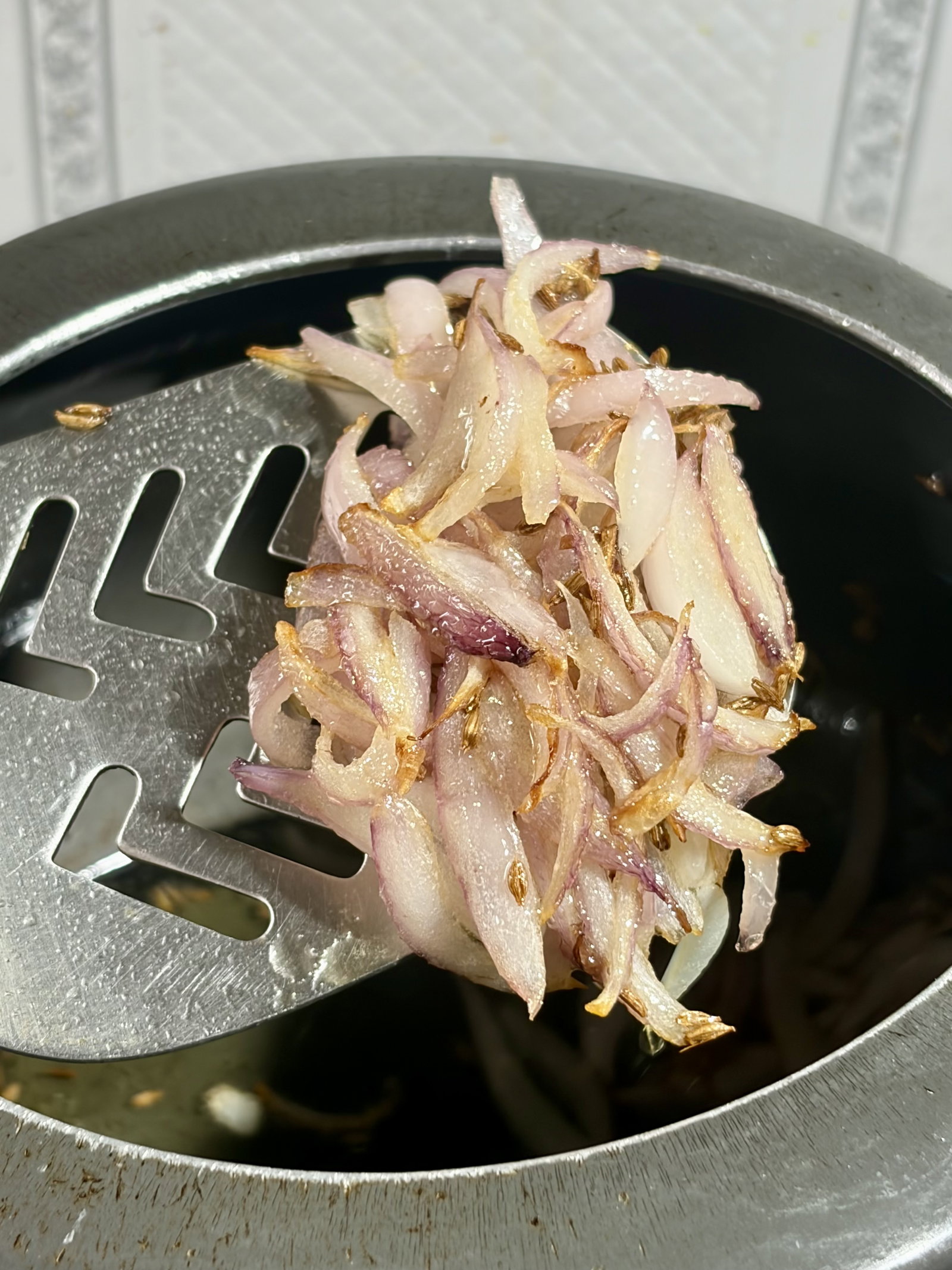 Step 1.1: Add the sliced onions and sauté until the edges turn golden brown