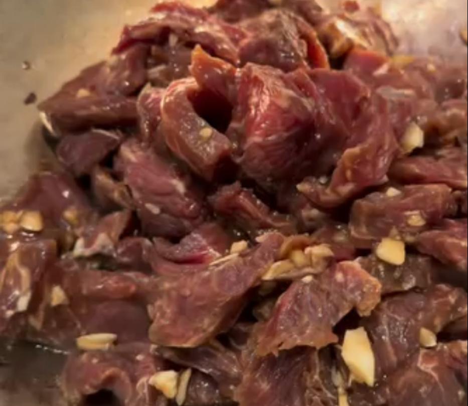 Step 1.1: Mix GF soy sauce, GF oyster sauce, GF fish sauce, 1 tbsp avocado oil, sesame oil, garlic powder, honey, and half of the minced garlic with the sliced beef in a bowl