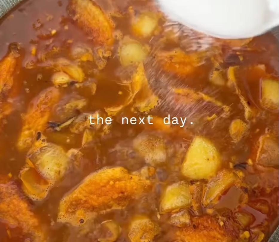 Step 1.1: Pour in the water used for boiling the vegetables, add extra water to cover the wings, then add soy sauce, fish sauce, sugar, and chilli oil