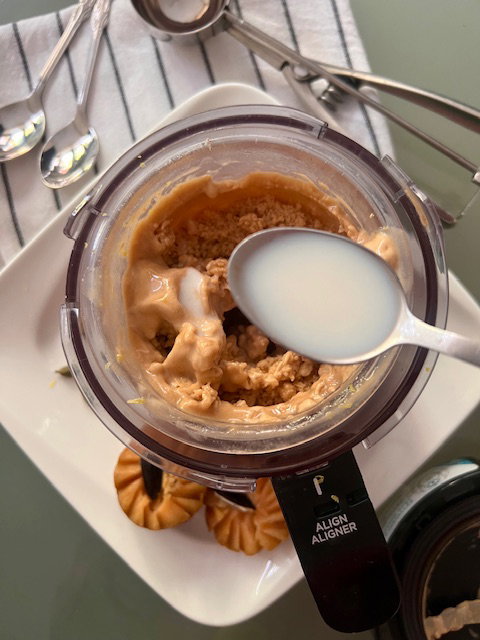 Step 5.1: If the texture appears crumbly after the first spin, add 1–2 tablespoons of milk and run the Re-spin function for an extra creamy finish