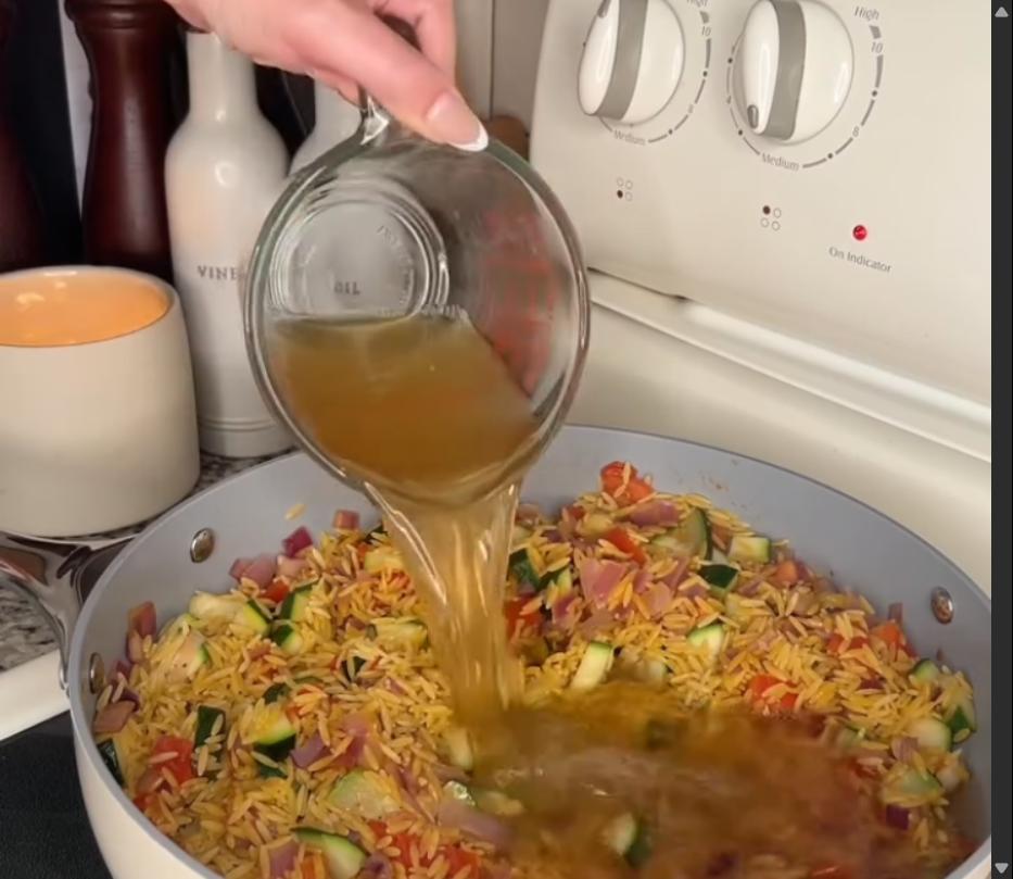 Step 2.1: Stir in orzo and chicken broth, then bring to a boil