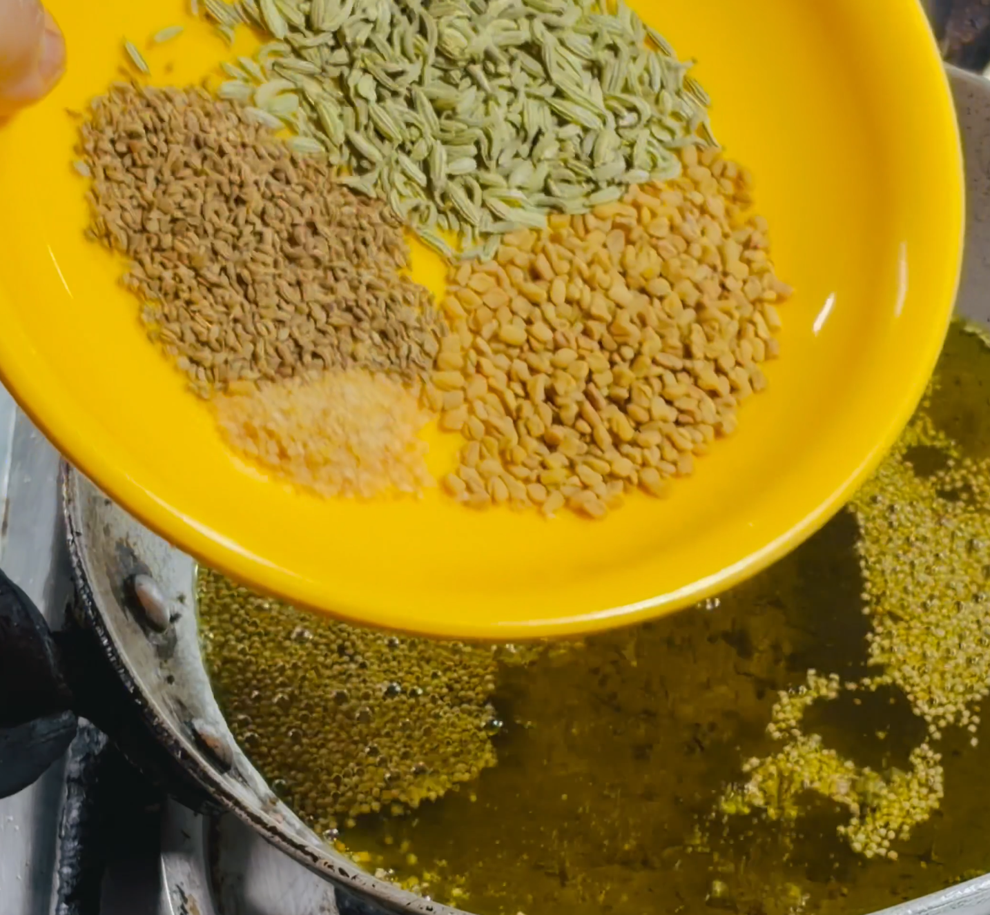 Step 3.1: Stir in the fenugreek seeds, fennel seeds, carom seeds, and asafoetida