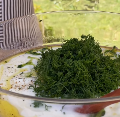 Step 2.1: Mix shredded cucumbers with Greek yogurt, crushed garlic, fresh dill, white wine vinegar, olive oil, salt, and black pepper