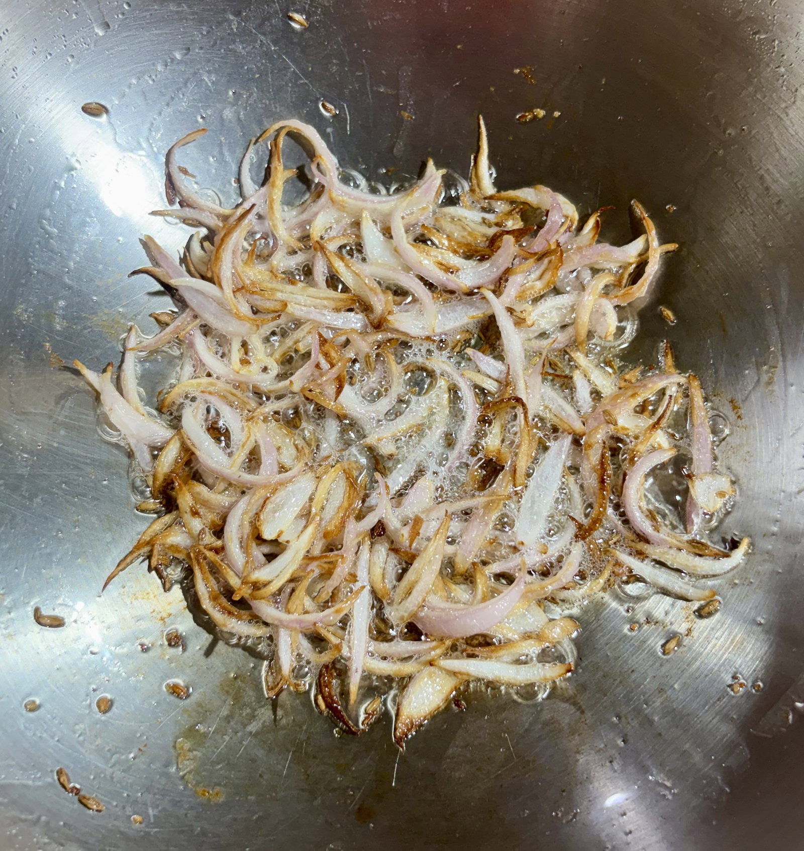 Step 2.2: Add the sliced onion and sauté until the edges turn golden brown