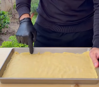 Step 2.1: Spread one portion evenly in your pan to form a layer about 0