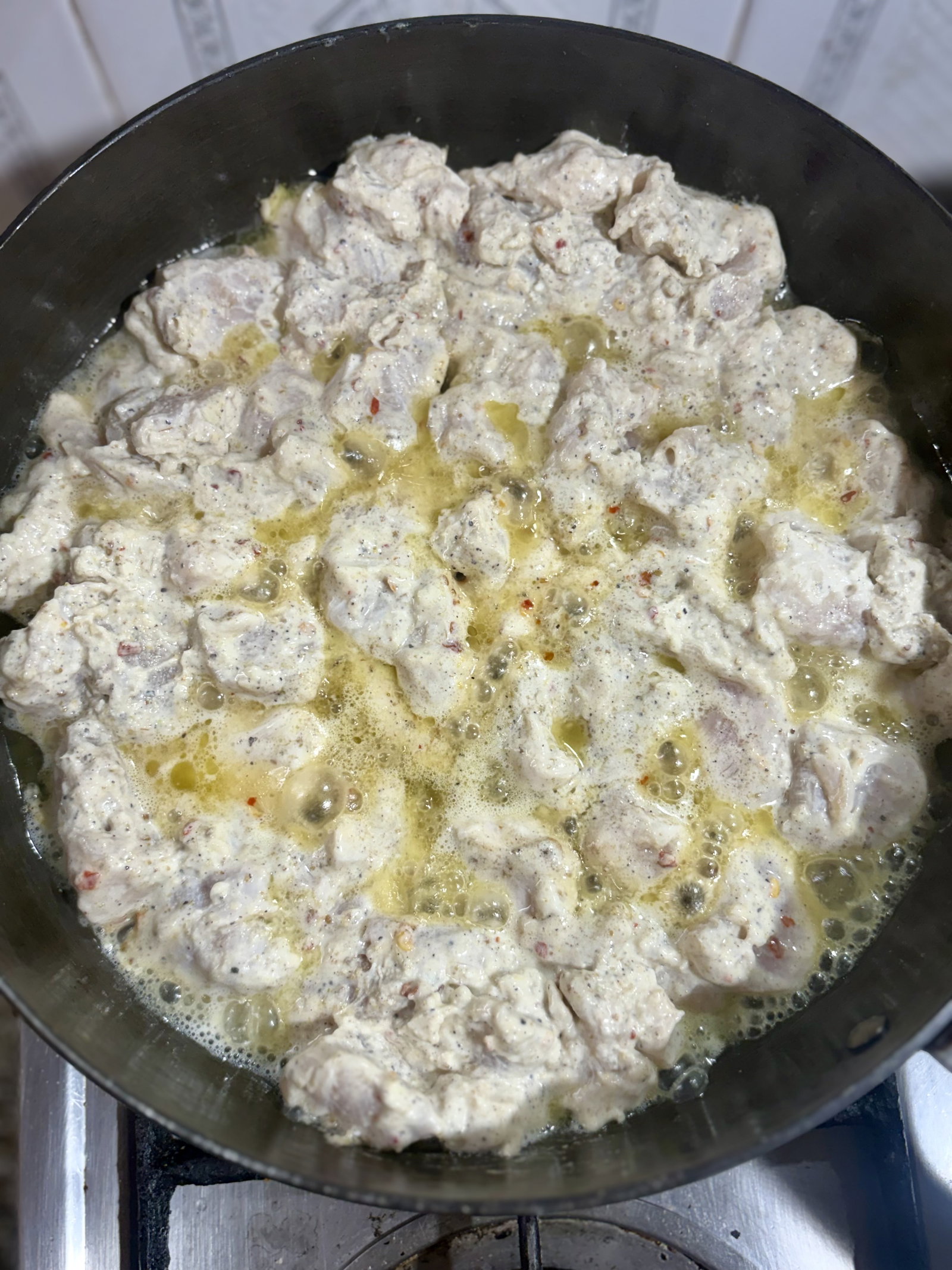 Step 2.1: Lift the chicken pieces from the marinade, shaking off the excess (reserve the marinade for later)