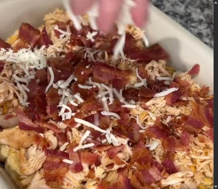 Step 3.1: Brush with melted butter mixture and top with cheddar cheese, chicken, bacon, mozzarella cheese, ranch dressing, and the top half of Hawaiian rolls