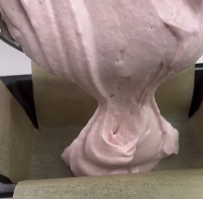 Step 1.1: Spread the glossy pink mixture into a parchment-lined loaf pan and let it chill in the fridge