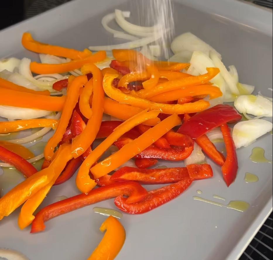 Step 1.1: Place onion and bell peppers on a large baking sheet