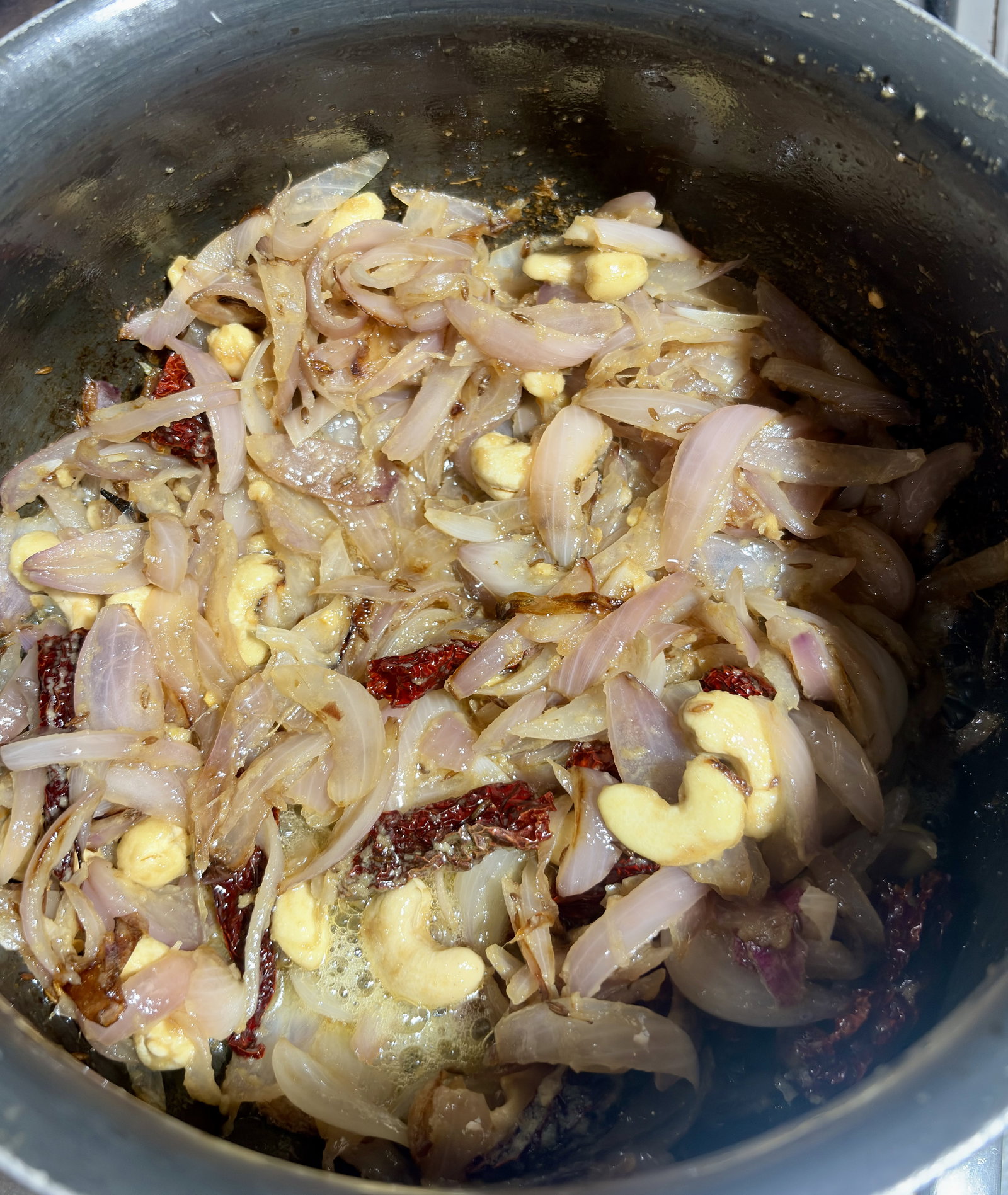 Step 1.1: Stir in the ginger-garlic paste, cashews, and Kashmiri chillies