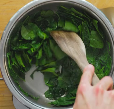 Step 2.1: Cook the spinach in a pan until wilted