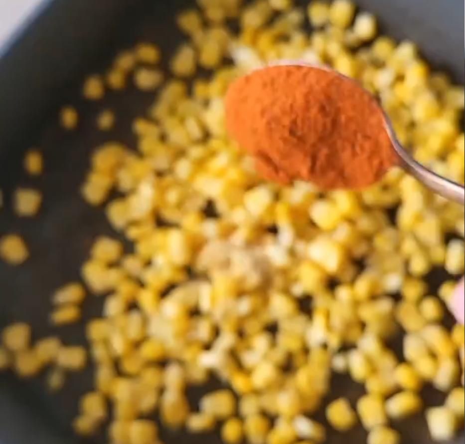 Step 1.1: Add sweetcorn to a baking tray with onion powder, garlic granules, paprika, olive oil, and salt