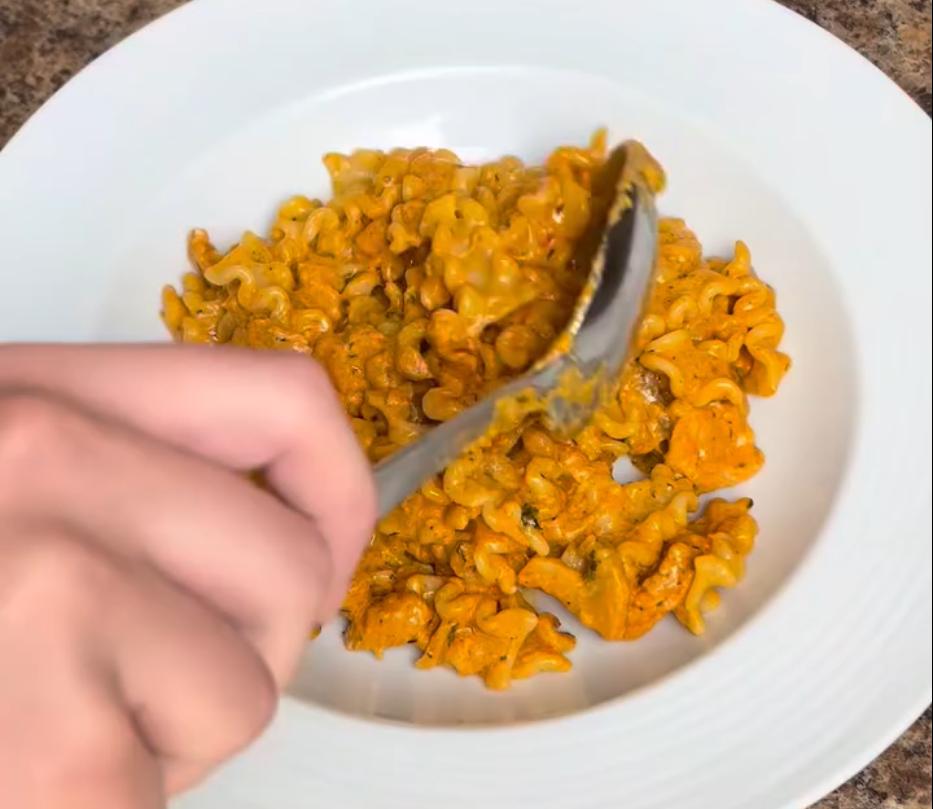 Step 5.1: Combine the cooked pasta with the sauce and chicken