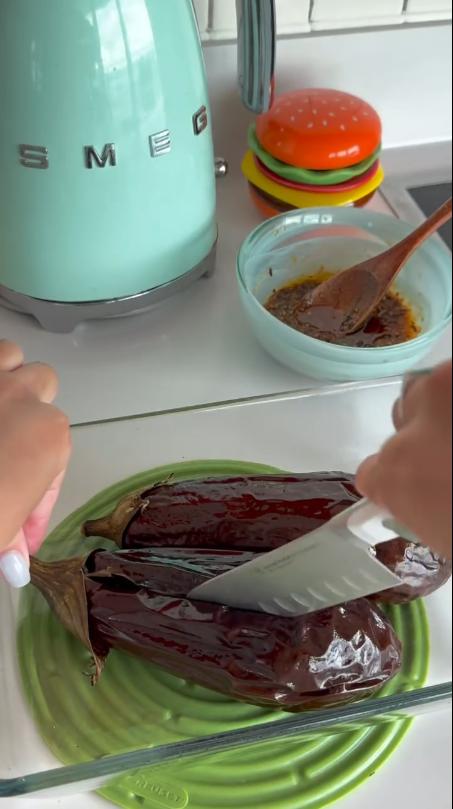 Step 1.1: Slice the baked aubergines in half and score the flesh without cutting through the skin