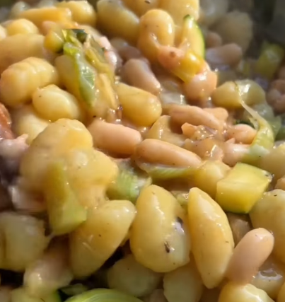 Step 3.1: Add the white beans and cooked gnocchi to the pan, stirring to combine