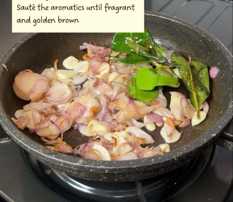 Step 1.1: Saute the rice aromatics (shallots, garlic, galangal, lemongrass, lime leaves, bay leaf) until fragrant and golden brown