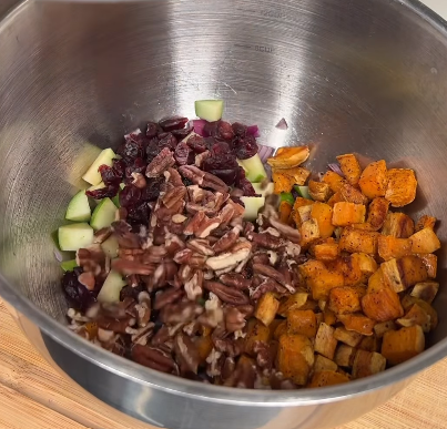 Step 3.1: In a large bowl, combine cooked quinoa, roasted sweet potatoes, diced red onion, diced green apple, dried cranberries, and chopped pecans