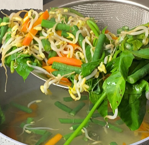 Step 3.1: Blanch carrot, long beans, bean sprout, and water spinach in boiling water for 2-3 minutes