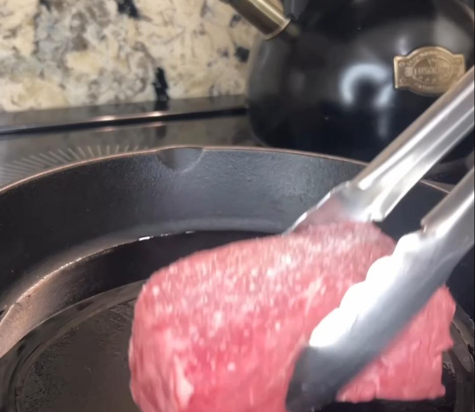 Step 2.1: Heat olive oil in a separate cast iron pan and sear all sides of the steak until a crispy brown crust forms