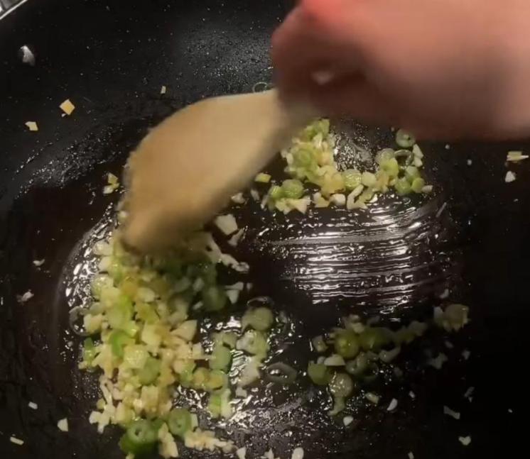 Step 1.1: Remove the chicken, then add the ginger, garlic, and the whites of the spring onion to the pan