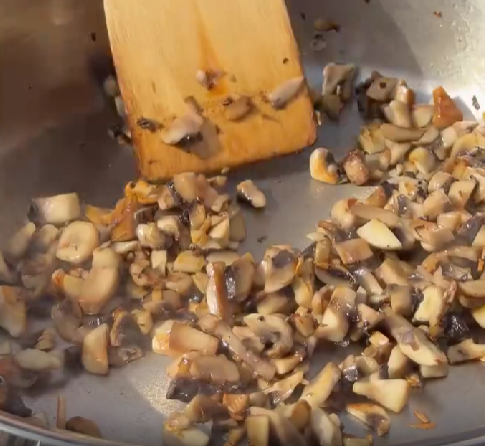 Step 2.1: Heat olive oil in a pan and sear diced mushrooms on high heat until golden