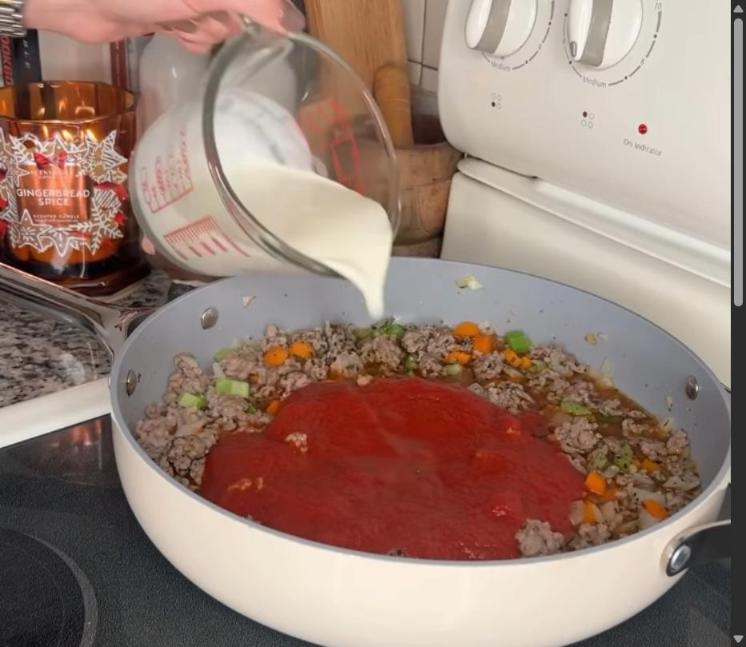 Step 4.1: Mix in tomato sauce, chicken broth, and heavy cream, and bring to a boil