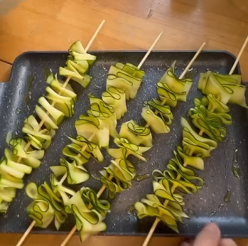 Step 1.1: Thread the zucchini onto skewers, leaving a little space between each piece
