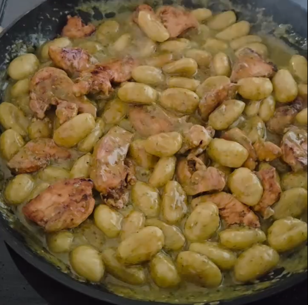Step 1.1: Return the cooked chicken to the pan and mix everything together