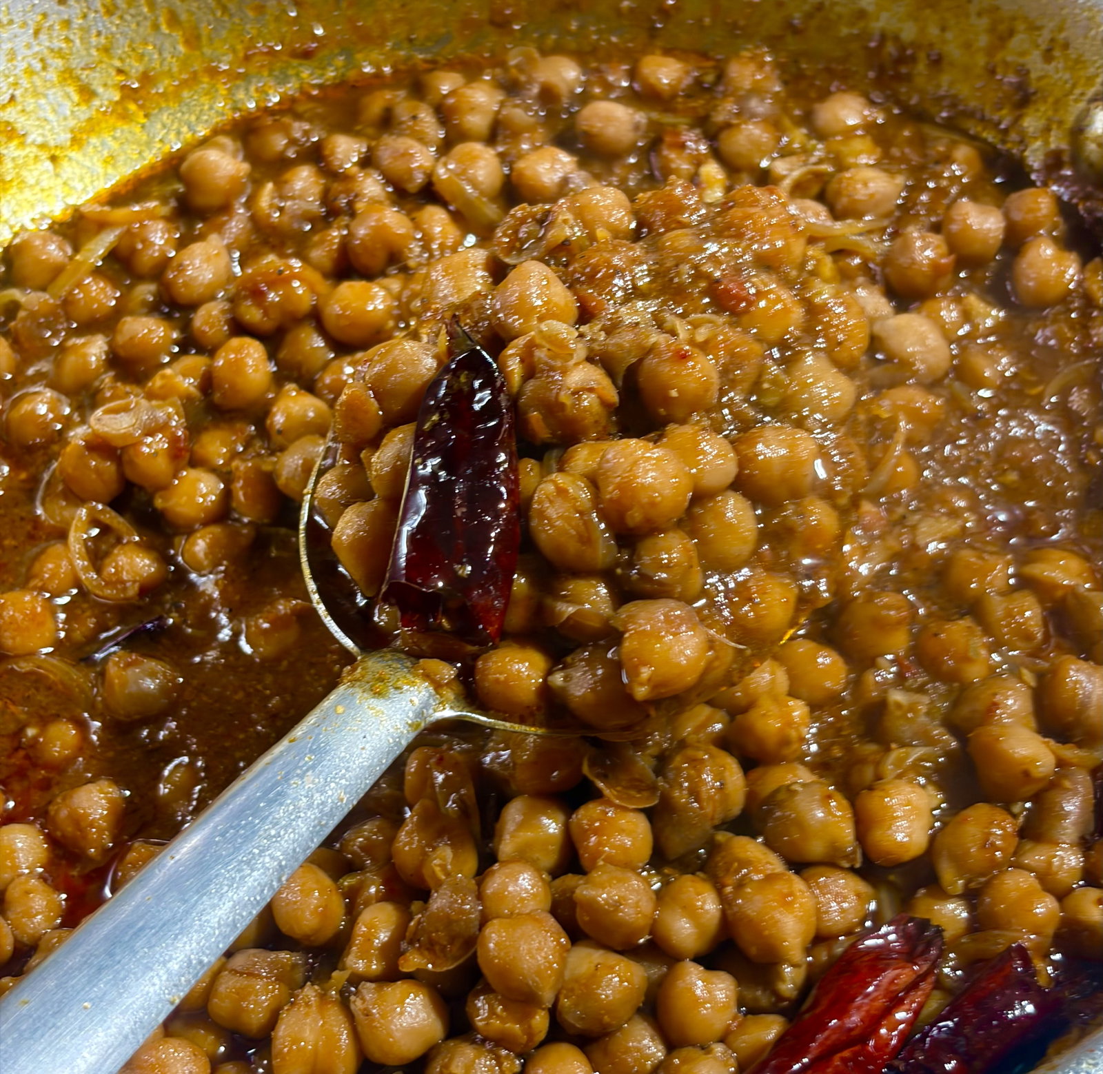 Step 3.1: Serve hot with bhatura, puri, kulcha, crisp paratha or rice with a side of sliced onions, green chillies, and lemon wedges Enjoy!