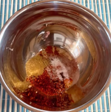 Step 1.1: Pour the hot oil over the dry ingredients in the mixing bowl and stir until combined