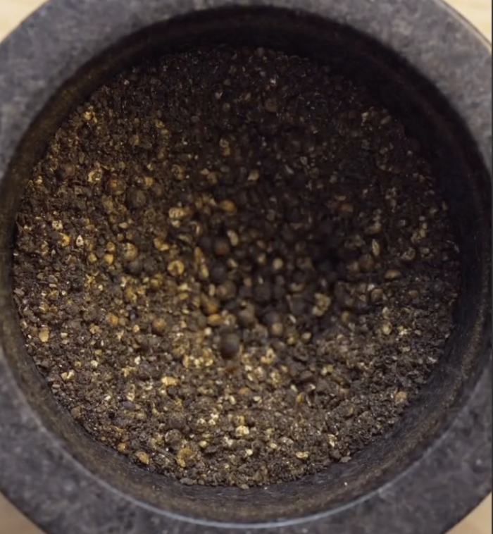 Step 2.1: Toast the black peppercorns in a dry pan until fragrant, then crush roughly in a mortar and pestle