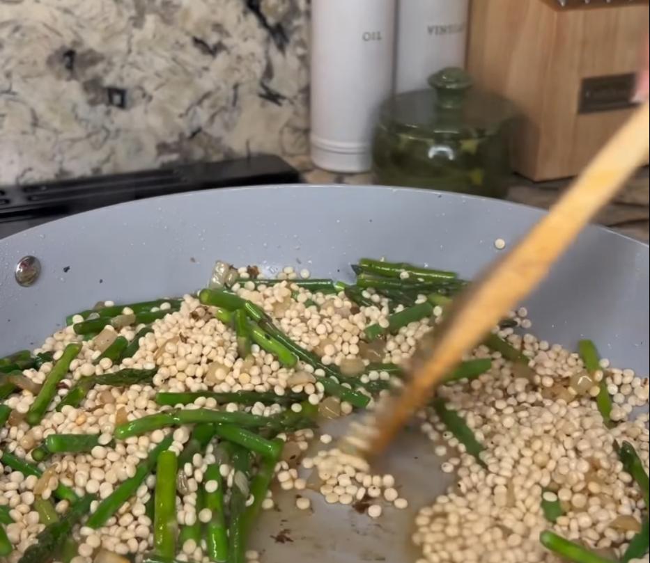 Step 2.1: Add pearl couscous to the pan and toast for one minute