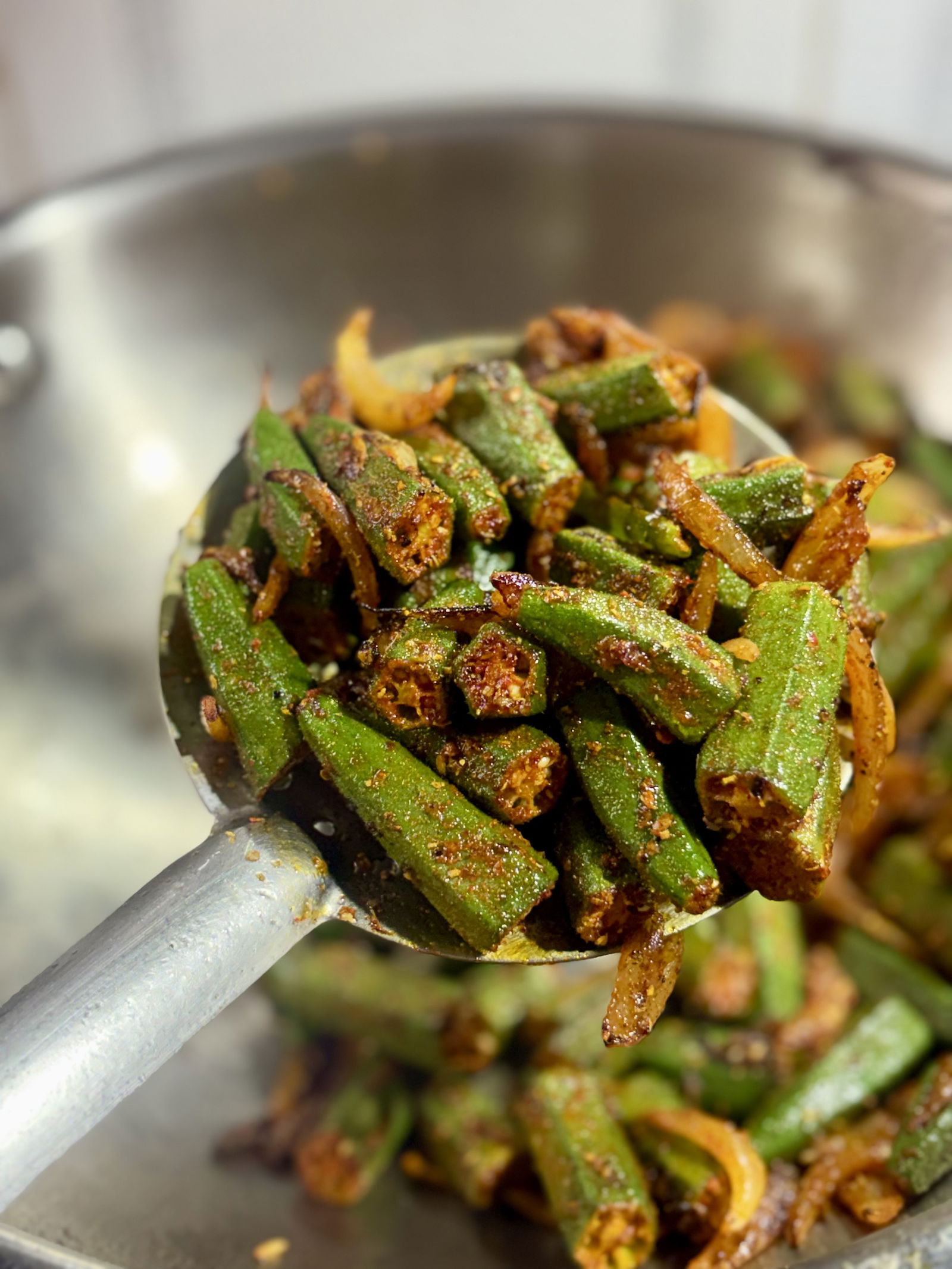 Step 4.2: Add the spiced bhindi to the pan