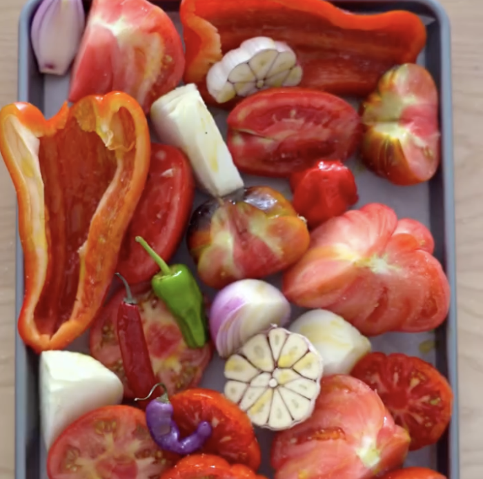 Step 1.1: Place the tomatoes, red bell pepper, red onion, garlic (cut in half), and red chili peppers on a baking tray