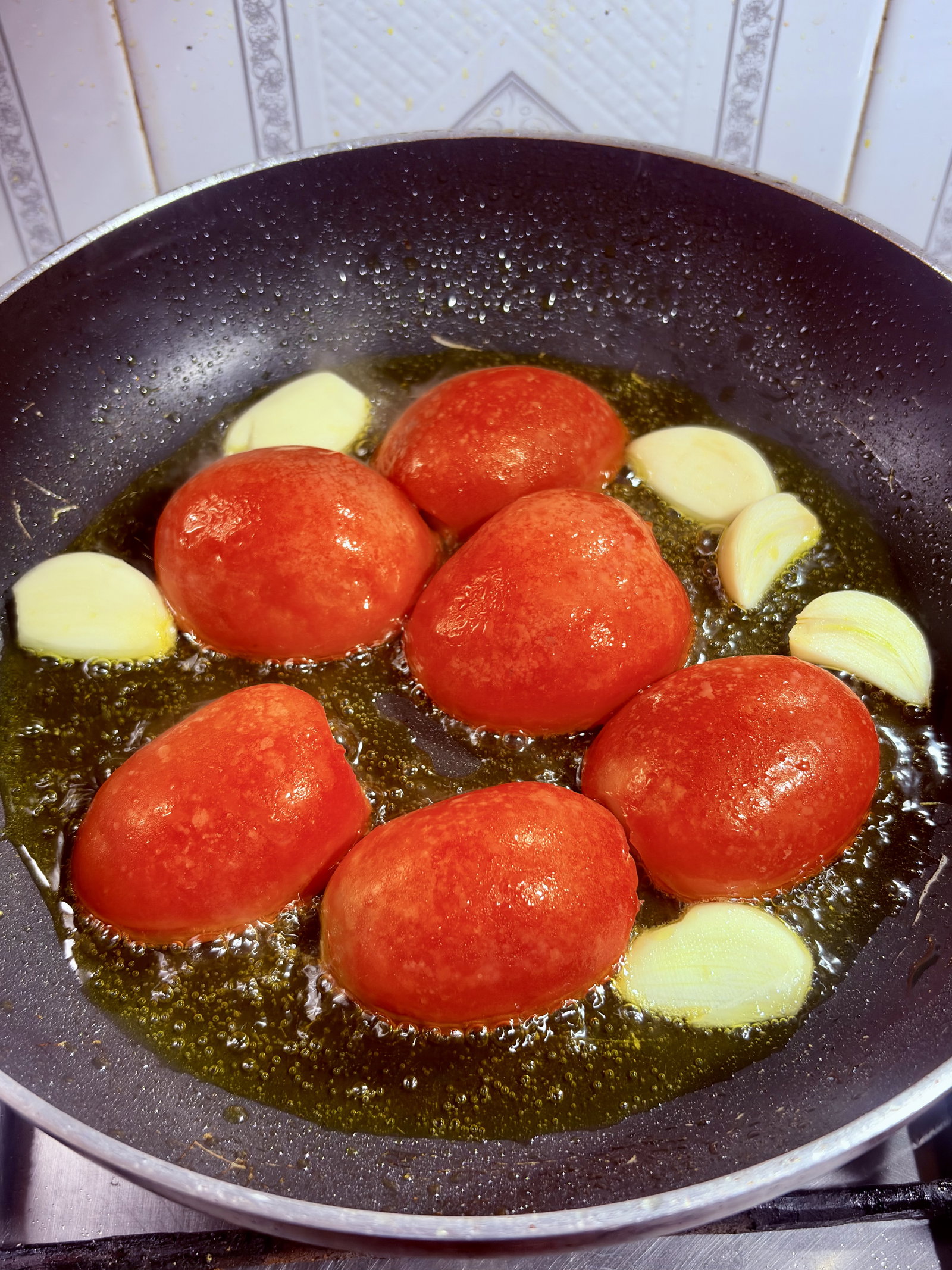 Step 1.1: Add the halved tomatoes (cut side down) and garlic cloves